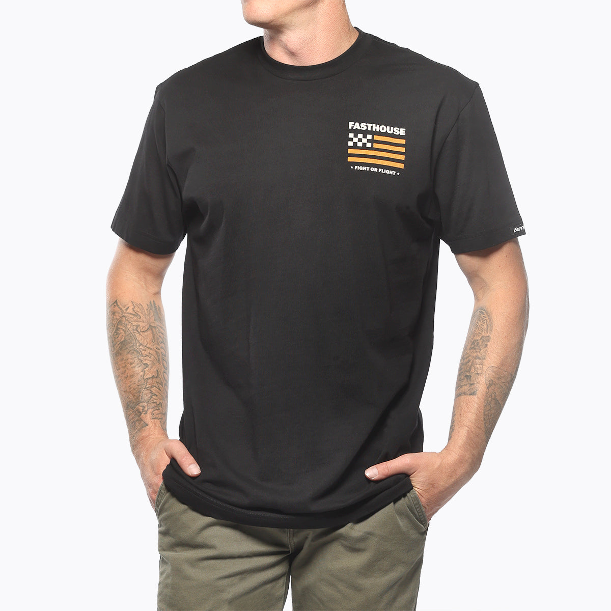Person wearing Unite Man wearing black tee standing against plain white background
