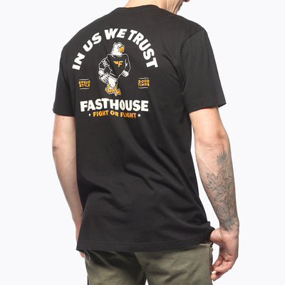 Person wearing Unite Man wearing black tee standing against plain white background