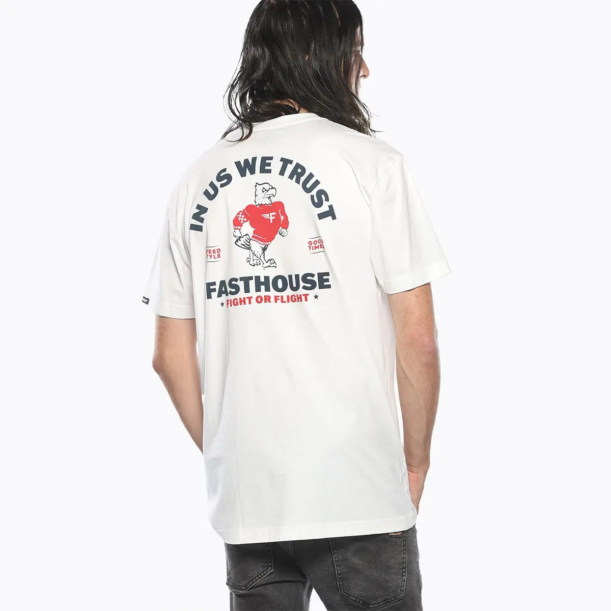Person wearing Unite Black Tee, White tee worn casually against neutral studio background - Slowride Supply