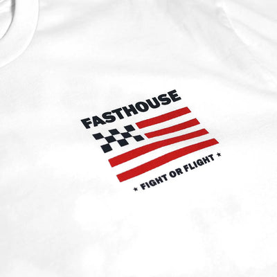 Close-up of Unite Black Tee showing Black checkered flag and red stripes with text "FASTHOUSE" and "FIGHT OR FLIGHT -