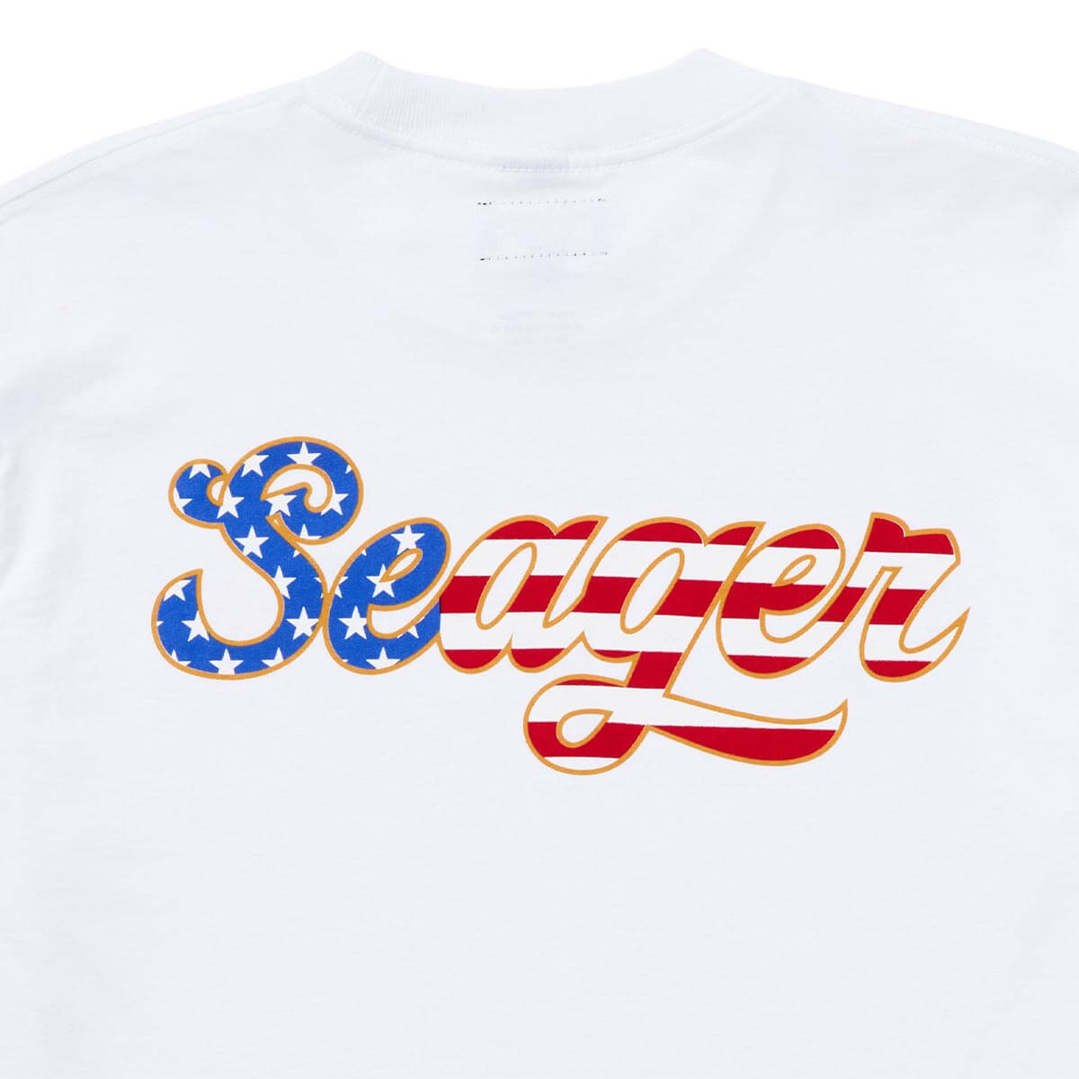 Close-up of USA Russ Vintage Black Tee showing White with blue-and-stars script lettering and red-and-white striped text,