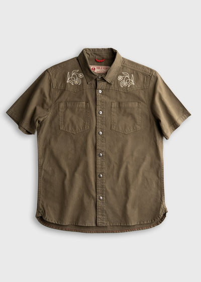 Westy Shirt S/S Woven front view, Light khaki with white winged engine embroideries on chest yoke and dual front pockets,
