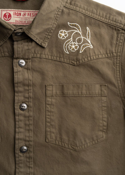 Close-up of Westy Shirt S/S Woven Light Khaki S/S Woven showing White and gold embroidered floral scroll on chest pocket