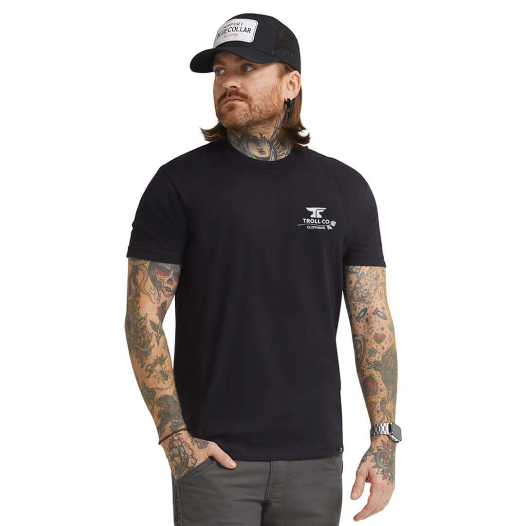 Person wearing WHUS Butterface 4.0 Black Tee, Man wearing black tee against plain white studio background - Slowride Supply
