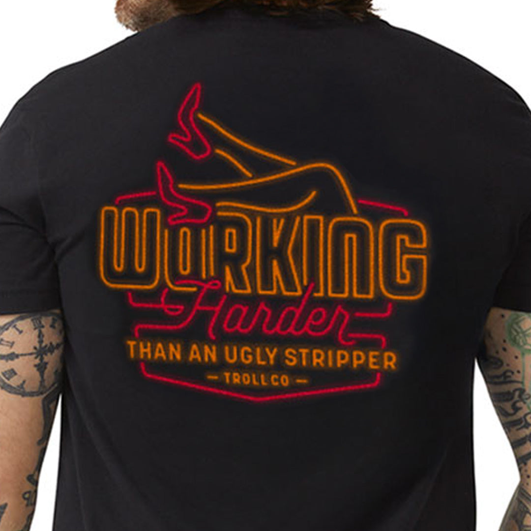 Person wearing WHUS Neon Black Tee, Wearer shown from behind in an indoor studio setting with white background - Slowride