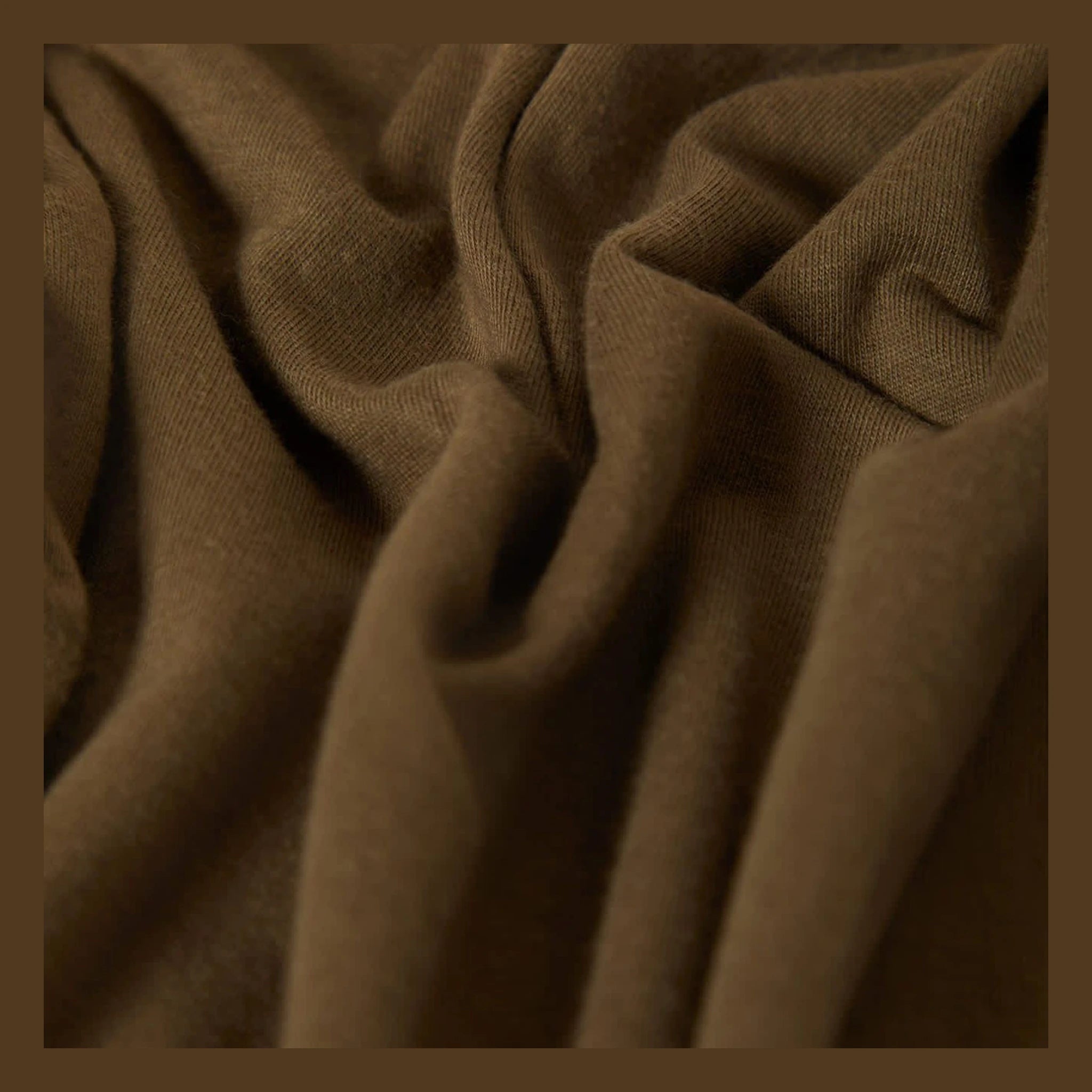 Close-up of Woodburn Tank Top Washed Black/white Tank Top showing Tan ribbed knit fabric with diagonal texture and soft