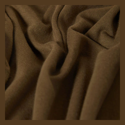 Close-up of Woodburn Tank Top Washed Black/white Tank Top showing Tan ribbed knit fabric with diagonal texture and soft