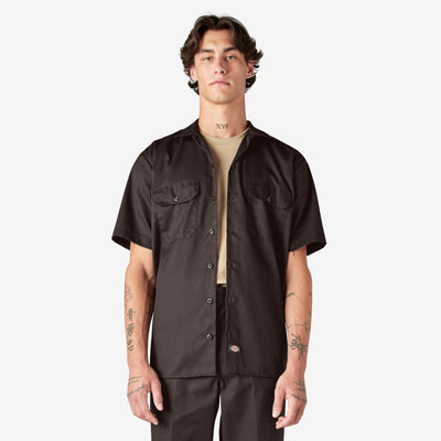 Person wearing Woven Twill Shirt S/S Woven Black S/S Woven, Man wearing black short-sleeve work shirt against plain white