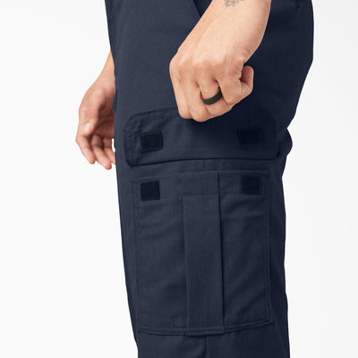 Person wearing Wp595 Cargo Pant Regular Fit Pants Black Pants, Wearer's hand reaching into cargo pocket on thigh of dark