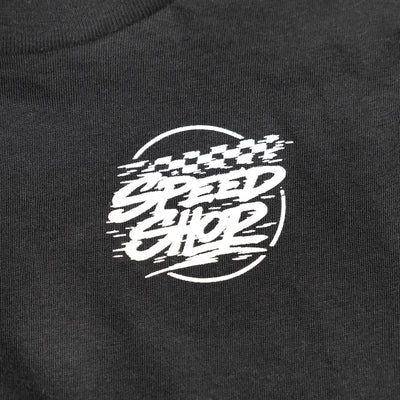 Close-up of Youth Burner Tee Kids Black Kids Tee showing White embroidered script graphic with speed lines and circular