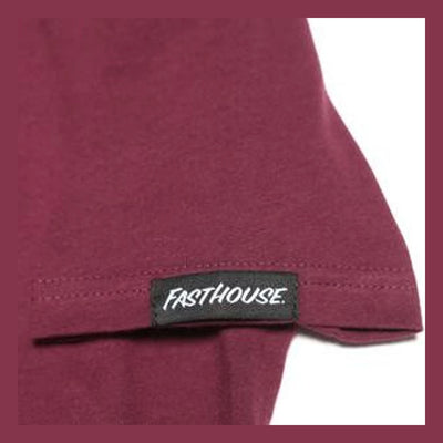 Close-up of Youth Chatlet Tee Kids Maroon Kids Tee showing Black woven label with white script text on maroon garment