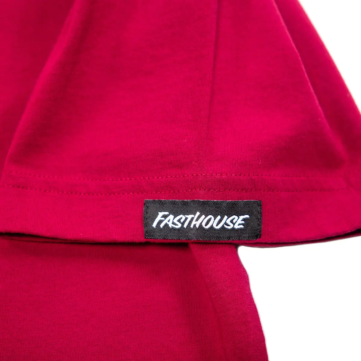 Care label on Youth Crossroads Tee Cardinal Kids Kids Tee showing Black woven label with white italic text reading