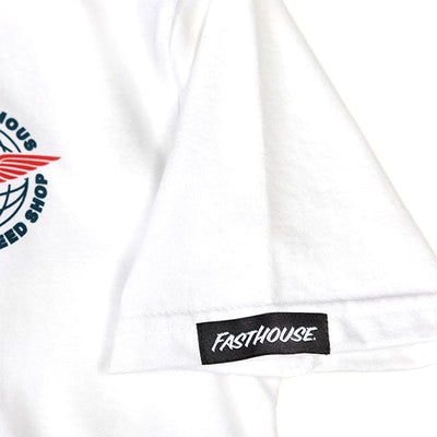 Close-up of Youth Renown Tee Kids White Kids Tee showing Black woven label with white script text on white garment hem -