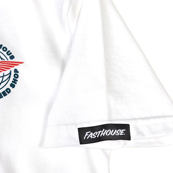 Close-up of Youth Renown Tee Kids White Kids Tee showing Black woven label with white script text on white garment hem -