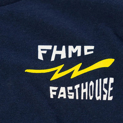 Close-up of Youth Team Tee Navy Kids Navy Kids Tee showing White embroidered text with yellow lightning bolt graphic on navy