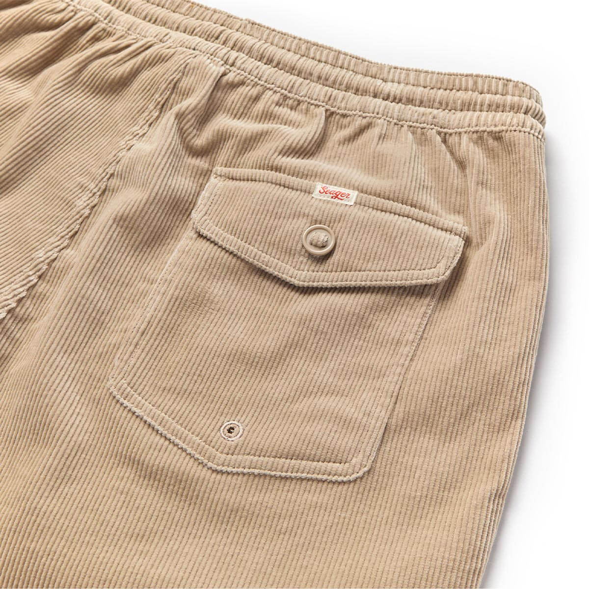 Close-up of Yuma Shorts Dark Olive Shorts showing Ribbed fabric texture with dual cargo pockets and button closures -